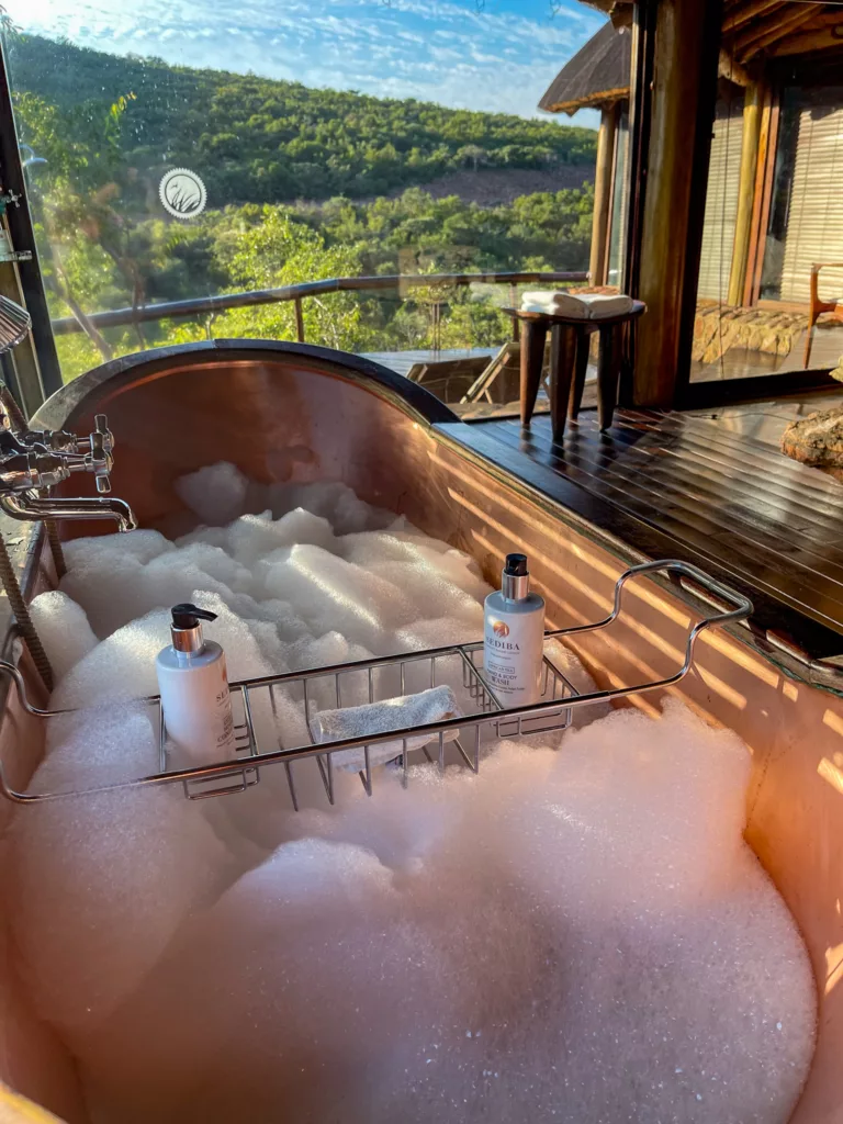 The beautiful copper free-standing bathtub with exquisite views at Sediba Luxury Safari Lodge