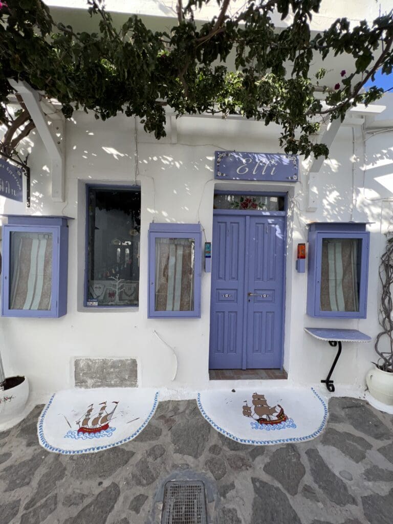 Hotels in Plaka Milos from the outside with purple windows