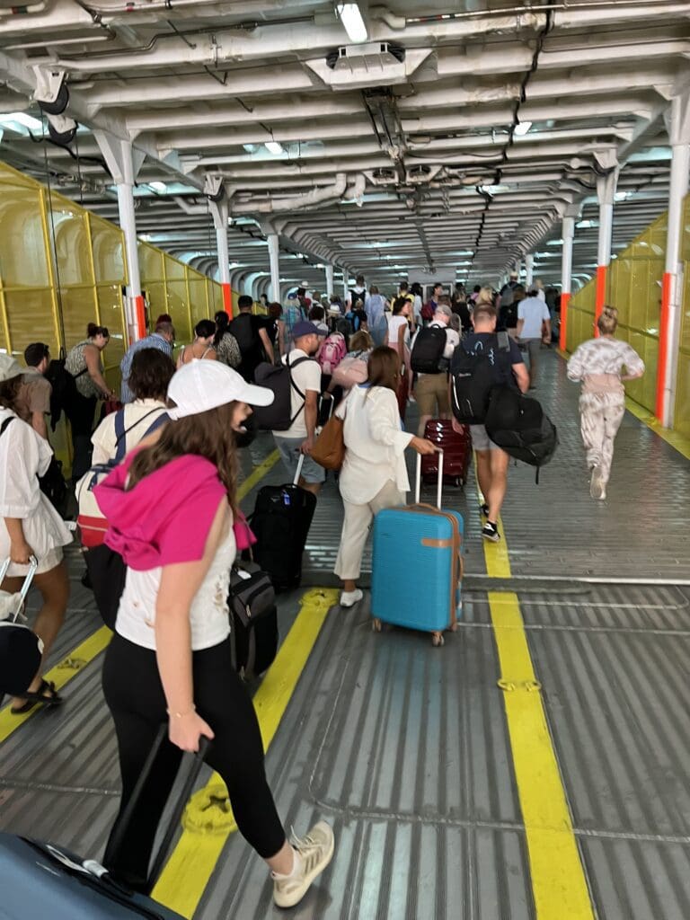 Passengers boarding a ferry in Greece