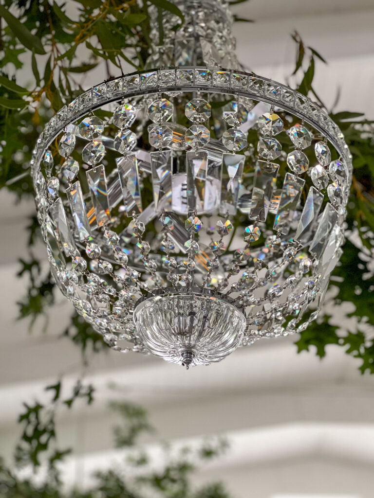 The stunning Christal-chandeliers in the wedding function hall from the outside at The Form White Light