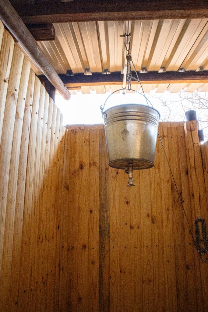 A bucket water system shower