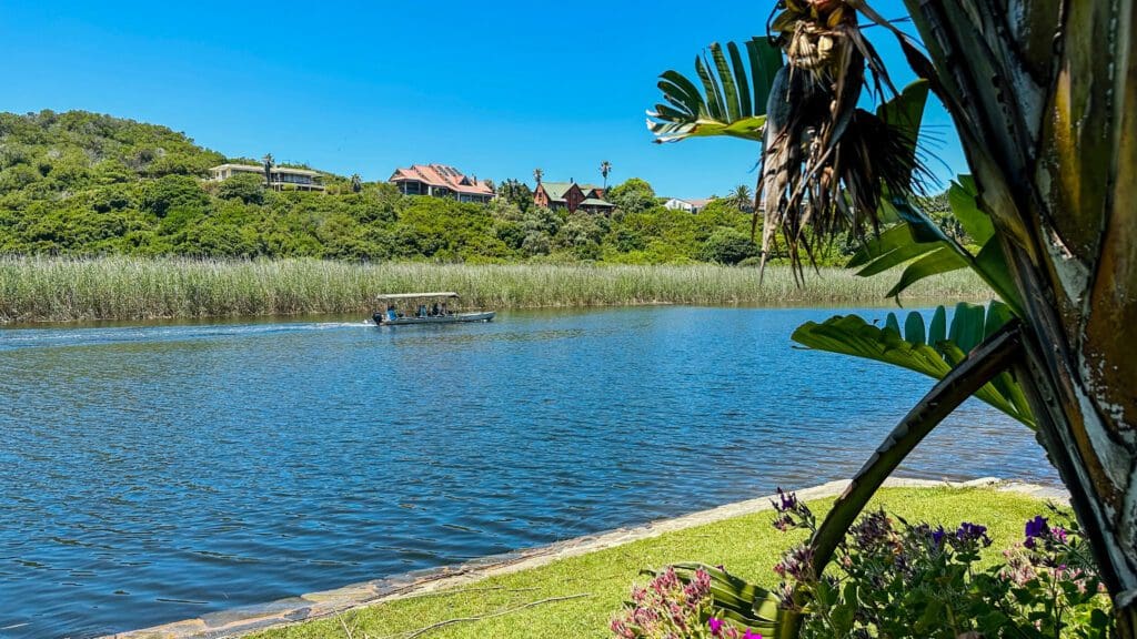 Wilderness, South Africa, Garden Route river views and little boat cruising by