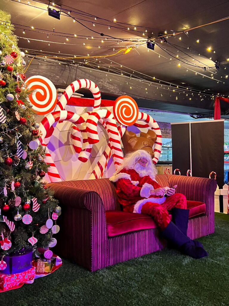 A Christmas Father Sitting on a chair at a Christmas Festival in Johannesburg