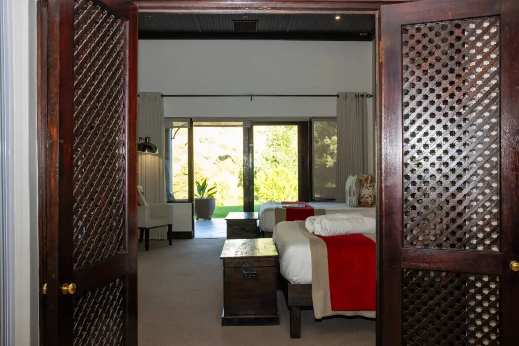 Deluxe room at Wildehondekloof with open patio and views over the Klein Karoo