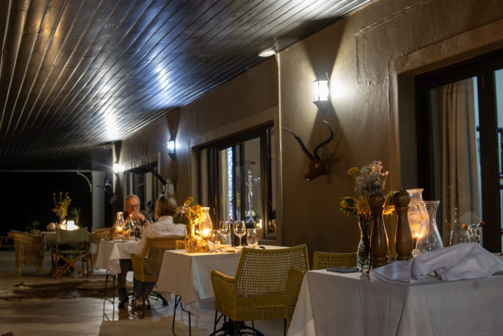 the romantic Wildehondekloof Candle light dinners at a patio on a game lodge