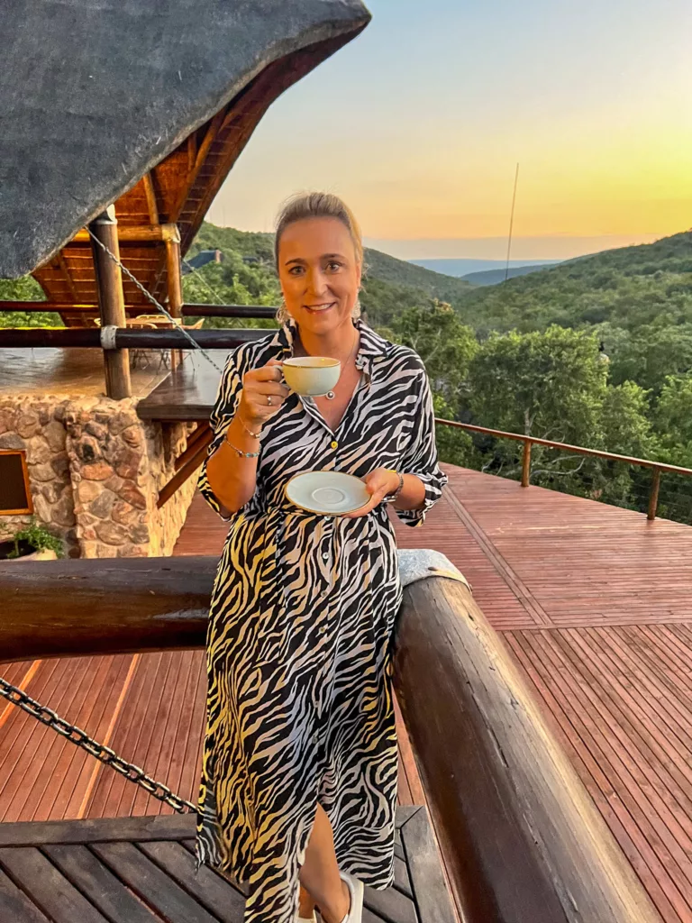 Bernie enjoying her morning coffee before the game drive at Rock Lodge