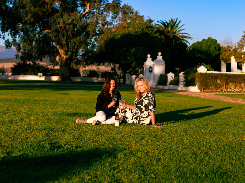Enjoying sun downers on the lawns of the original Homestead