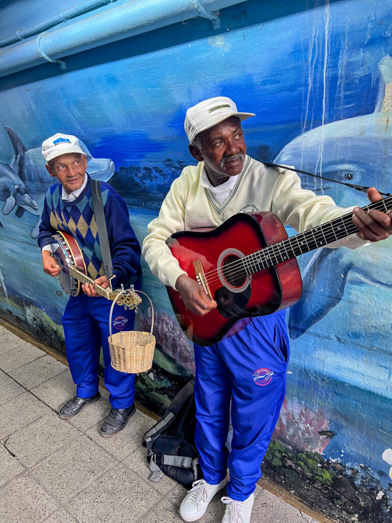 Musician playing folk music in the subway in Kalk Bay