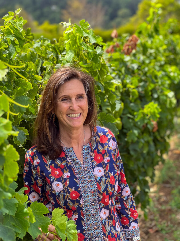 Petra standing in the vineyard at Constantia Glen Farm