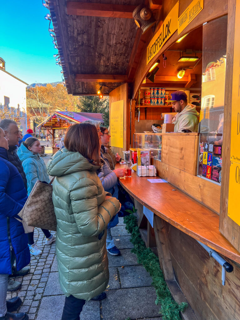Petra buying something to eat from one of the food vendors at Bad Reichenhall Christmas Market