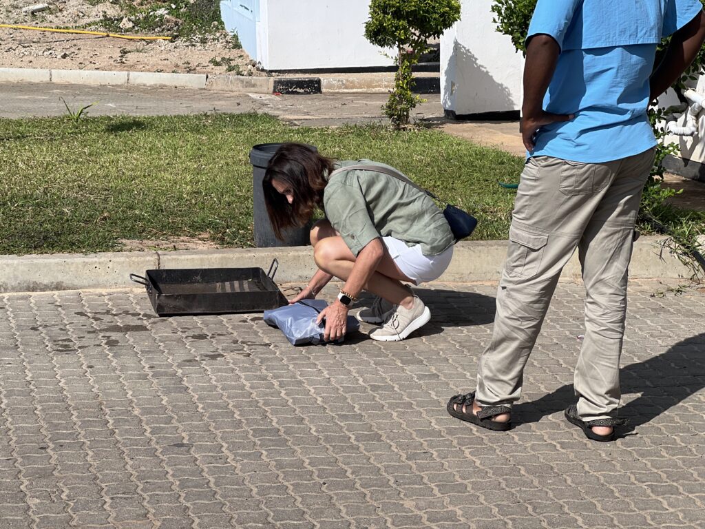 Petra dipping her shoes at a border crossing