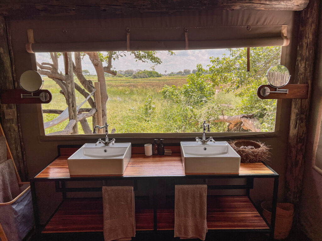 The view from our tent's bathroom with double vanities internal and external shower and outside bath
