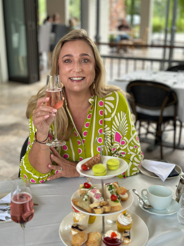 Bernie enjoying our high tea wearing her beautiful dress she bought from the on-site boutique