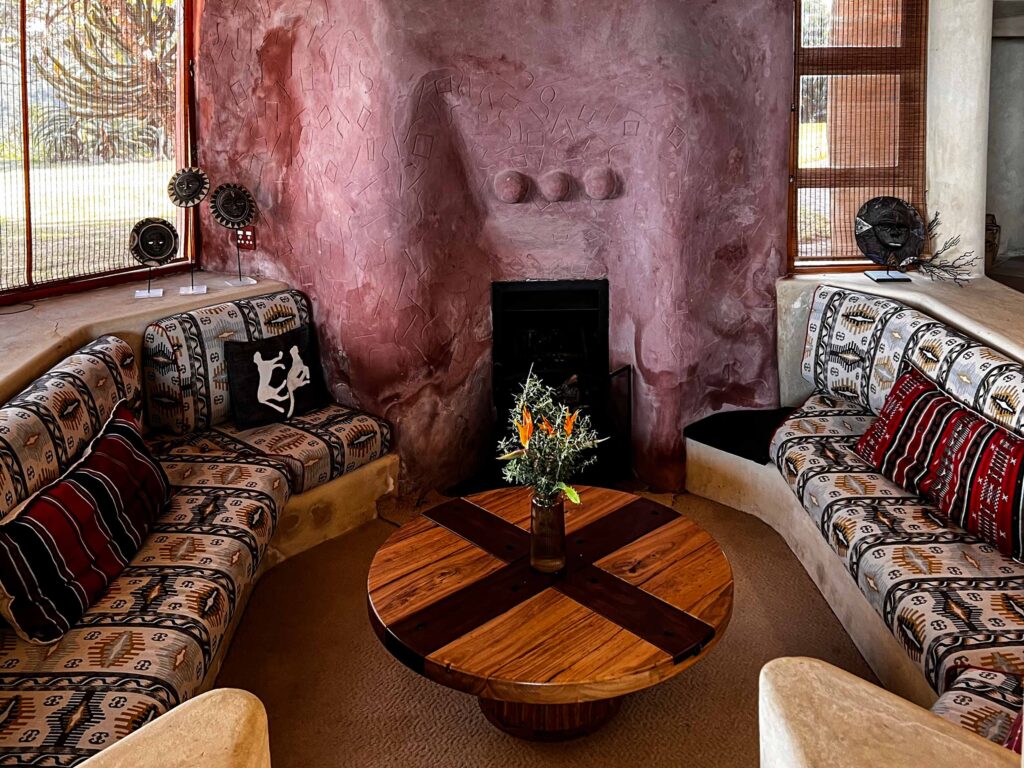Lounge with pink fire place.